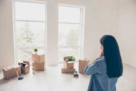 woman organizing her boxes after a move